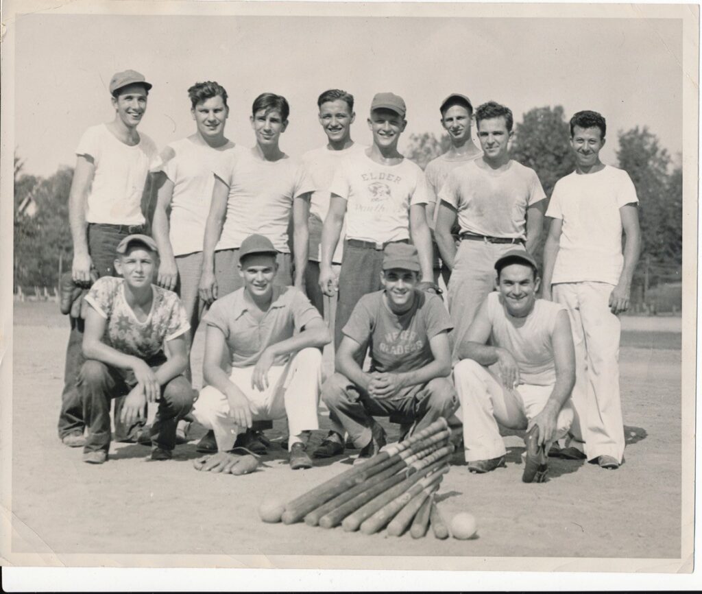 An old photo showing a group of men on a local softball team. 